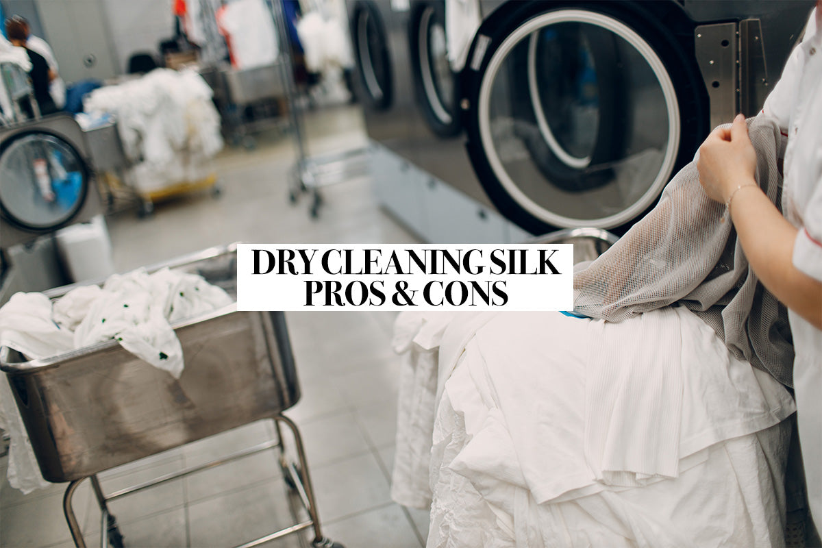 Person dry cleaning laundry, including a white silk pillowcase, in a laundrette.