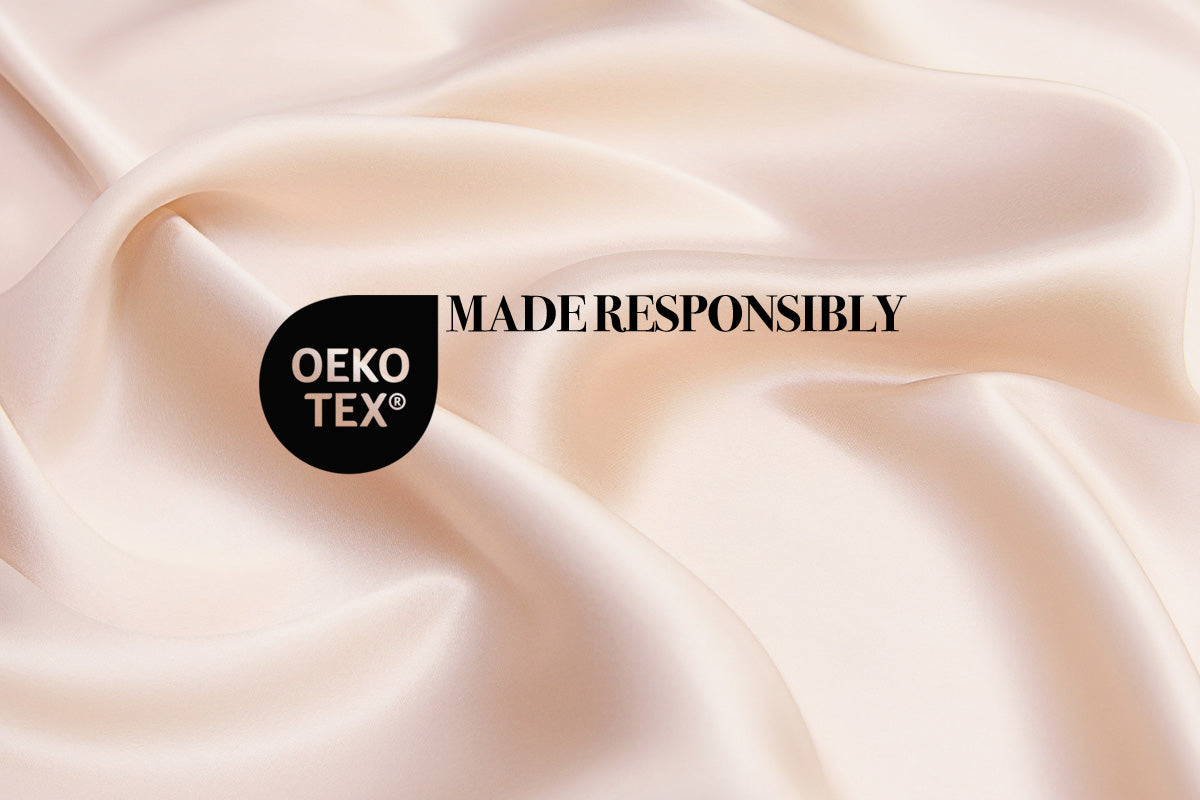 Mulberry silk fabric with an Oeko-Tex logo overlay, indicating that Sleek Silk is responsibly sourced and free from harmful substances.