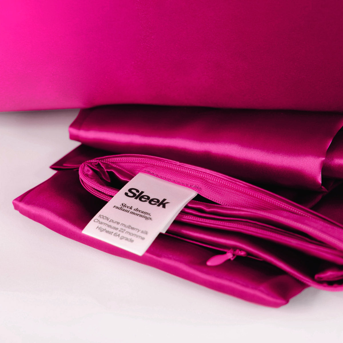 Bright pink 100% pure mulberry silk pillowcase, highest quality 22 Momme, soft and smooth, standard size 50x75cm, zipper closure.